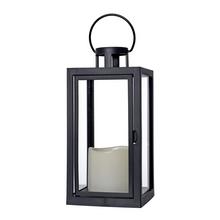 Čierna LED lucerna so sviečkou.