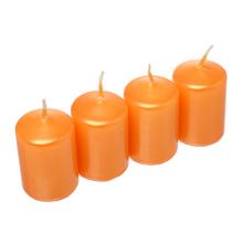 Sviečky adventné v oranžovej farbe.