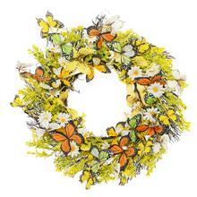 Zelenožltý veniec s motýľmi a kvetmi.