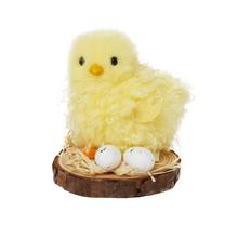 Kuriatko na podstavci s vajíčkami