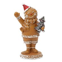 Perníkový chlapec s čiapkou a stromčekmi