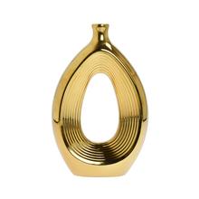 Zlatá keramická váza s moderným dizajnom.