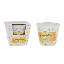 Voňavá sviečka v skle s motívom zlatej a striebornej hviezdy.