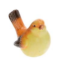 Keramický vtáčik v žlto-oranžovej farbe.