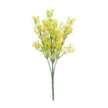 Žltá umelá kvetina s bielym a krémovým zápichom.