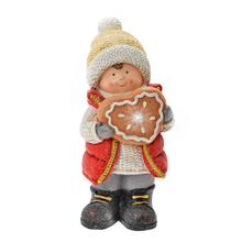 Chlapec s perníkom, dekorácia na Vianoce.