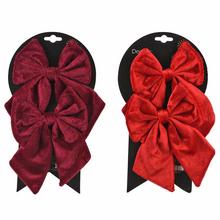 Súprava mašlí v bordovej a červenej farbe na karte.