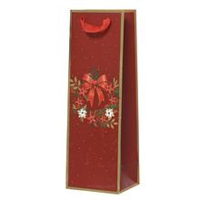 Vianočná papierová taška s motívom kvetinovej dekorácie.