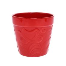 Červený obal s valčekom na kvety.