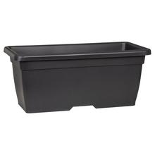 Dlhý kvetináč v metalickej šedej farbe.